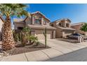 Charming two-story home featuring a desert landscape, two car garage and a terracotta tile roof at 4128 E Coolbrook Ave, Phoenix, AZ 85032