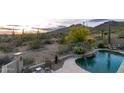 Mountain views abound from the outdoor patio and waterfall pool at 4632 S Alamos Way, Gold Canyon, AZ 85118
