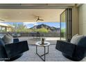 Indoor living space showcases a balcony with mountain views, creating a serene and inviting atmosphere at 5527 E Arroyo Verde Dr, Paradise Valley, AZ 85253