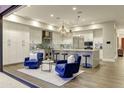 Bright, modern kitchen features a large island, stainless appliances, and comfortable seating area at 5527 E Arroyo Verde Dr, Paradise Valley, AZ 85253