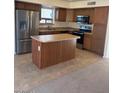 A modern kitchen featuring stainless steel appliances and a convenient center island at 56 W Holstein Trl, San Tan Valley, AZ 85143