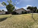 Well-maintained front yard with lush green grass complementing the home's exterior at 601 W 15Th St, Tempe, AZ 85281