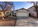 Inviting single-story home featuring a two-car garage and established desert landscaping at 6331 W Winslow Ave, Phoenix, AZ 85043