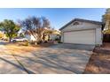 Well-maintained home featuring a two-car garage, desert landscaping, and a lengthy driveway at 6331 W Winslow Ave, Phoenix, AZ 85043
