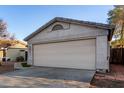 Spacious two-car garage with an attractive panel door and well-kept driveway at 6331 W Winslow Ave, Phoenix, AZ 85043
