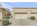 Charming single-story home featuring a two-car garage and desert landscaping at 6730 E Hermosa Vista Dr # 38, Mesa, AZ 85215