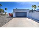 Spacious two-car garage featuring modern design and ample parking at 6801 E Sheena Dr, Scottsdale, AZ 85254