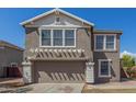 Beautiful two-story home with an attached two-car garage and an attractive front facade at 7230 N 70Th Ln, Glendale, AZ 85303