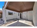 View of the covered carport leading to the front door with secure gate access at 7826 N 21St Ln, Phoenix, AZ 85021