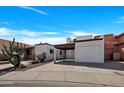 Charming single-Gathering home boasting desert landscaping, a covered carport, and a single-car garage at 7826 N 21St Ln, Phoenix, AZ 85021