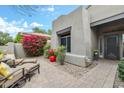 Inviting front yard featuring cozy outdoor seating and mature bougainvillea at 8235 E Sierra Pinta Dr, Scottsdale, AZ 85255