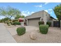 Beautiful home with desert landscaping, rock accents, and a private courtyard at 8235 E Sierra Pinta Dr, Scottsdale, AZ 85255
