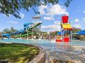 Gathering-friendly community pool with slides and water features for hours of entertainment at 8577 W Trenton Ct, Florence, AZ 85132