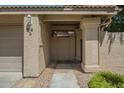 Charming covered front entrance with desert landscaping and the home address clearly displayed at 945 N Pasadena -- # 84, Mesa, AZ 85201
