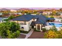 Stunning two-story home with mature landscaping, a pool, and a tile roof at 1501 N 67Th St, Mesa, AZ 85205