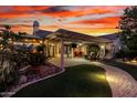 Backyard featuring stone landscaping, and an entertainment area under a covered patio at 1502 W Wagner Dr, Gilbert, AZ 85233