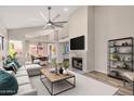 Bright open living room with modern furniture, fireplace, and view into the dining area at 4573 W Ivanhoe St, Chandler, AZ 85226