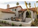 Inviting backyard patio with a cozy fire pit and comfortable seating, perfect for outdoor entertaining at 10266 E Caron St, Scottsdale, AZ 85258