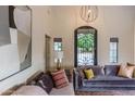 Charming living room with stylish sofas and a decorative chandelier at 10266 E Caron St, Scottsdale, AZ 85258