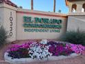 Welcoming El Dorado Condominiums sign with colorful flower bed, a community offering independent living at 10330 W Thunderbird Blvd # C-228, Sun City, AZ 85351
