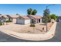 Charming single-story home with a well-maintained yard and a two-car garage in a friendly neighborhood at 11343 W Mccaslin Rose Ln, Surprise, AZ 85378