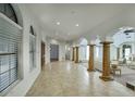 Spacious foyer with marble flooring, archways, and decorative columns at 14814 N Coral Gables Dr, Phoenix, AZ 85023