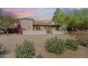 Charming single-story home with mature desert landscaping and decorative wall at 14814 N Coral Gables Dr, Phoenix, AZ 85023