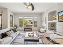 Cozy living room featuring ample natural light, sleek furnishings, and contemporary decor creating a relaxing atmosphere at 16600 N Thompson Peak Pkwy # 2050, Scottsdale, AZ 85260