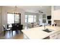Open-concept space with kitchen island, dining area, and inviting living room at 16600 N Thompson Peak Pkwy # 2050, Scottsdale, AZ 85260