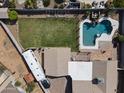 Aerial view of backyard featuring pool, patio, lush lawn, and RV parking at 232 W San Angelo St, Gilbert, AZ 85233