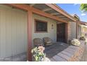 Inviting front porch with decorative brick accents, seating, and stylish entryway at 232 W San Angelo St, Gilbert, AZ 85233