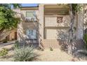 View of a condo with desert landscaping and mature shade trees at 29606 N Tatum Blvd # 265, Cave Creek, AZ 85331