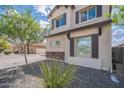 This is a view of the side of a home with low maintenance desert landscaping at 2969 E Trigger Way, Gilbert, AZ 85297