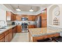 Well-equipped kitchen with stainless steel appliances and granite countertops at 3528 N Crystal Ln, Avondale, AZ 85392