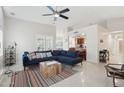 Comfortable living room with tile floors and view of the kitchen at 3528 N Crystal Ln, Avondale, AZ 85392