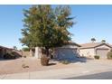 Inviting single-story house featuring a two-car garage and low-maintenance desert landscaping at 42430 W Oakland Dr, Maricopa, AZ 85138