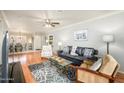 Bright living room with hardwood floors, grey walls, and decorative rug at 4303 E Cactus S Rd # 229, Phoenix, AZ 85032
