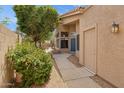 Inviting front entrance with a blue door, desert landscaping, and a private walkway to the main house at 5 W Ranch Rd, Tempe, AZ 85284