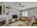 Cozy living room with fireplace, stylish decor, and a comfortable reclining sofa at 515 S Apache Dr, Chandler, AZ 85224