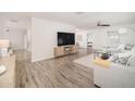 Open living room with wood flooring, modern furnishings, and plenty of natural light at 6130 E Windsor Ave, Scottsdale, AZ 85257