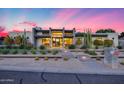 Stunning modern home featuring desert landscaping with a captivating pink and blue sunset backdrop at 12809 N 67Th St, Scottsdale, AZ 85254