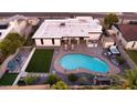 Backyard oasis featuring a pool, hot tub, lounge area, and desert landscaping, providing a private retreat at 15028 N 9Th St, Phoenix, AZ 85022