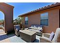 Private outdoor space with a fire pit, plush seating, and an inviting ambiance at 16370 W Granada Rd, Goodyear, AZ 85395