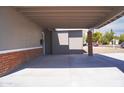Attached carport with space for multiple cars and access to the home's front door at 2035 W Claremont St, Phoenix, AZ 85015