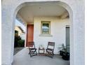 View of a covered front porch with stylish seating area, perfect for enjoying the outdoors at 2134 N Marketside Ave, Buckeye, AZ 85396