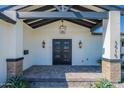 Stunning front porch features double doors, designer lighting, and stylish brick accents at 3010 E Glenrosa Ave, Phoenix, AZ 85016