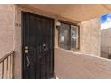 Charming condo entrance featuring secure door and a cozy, well-lit entryway at 7061 E Broadway Rd # 48, Mesa, AZ 85208
