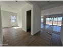 Open-concept living space with tile floors and large sliding doors opening to the backyard at 11422 E Utah Ave, Mesa, AZ 85212