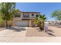 Beautiful two-story home with a well-maintained lawn, neutral colors, and a two car garage at 12825 W Virginia Ave, Avondale, AZ 85392