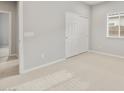 Spacious bedroom with neutral carpet, a closet with sliding doors, and a window, offering a comfortable retreat at 17770 W Getty Dr, Goodyear, AZ 85338